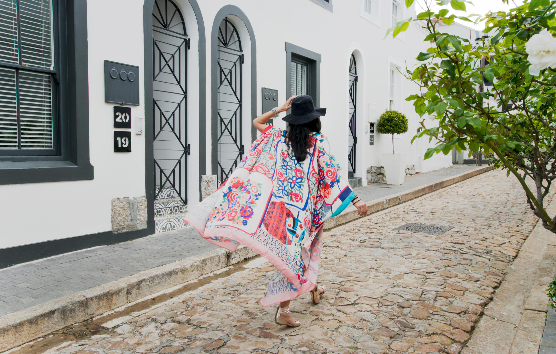 Woman exploring the streets around More Quarters Neighborhood hotel