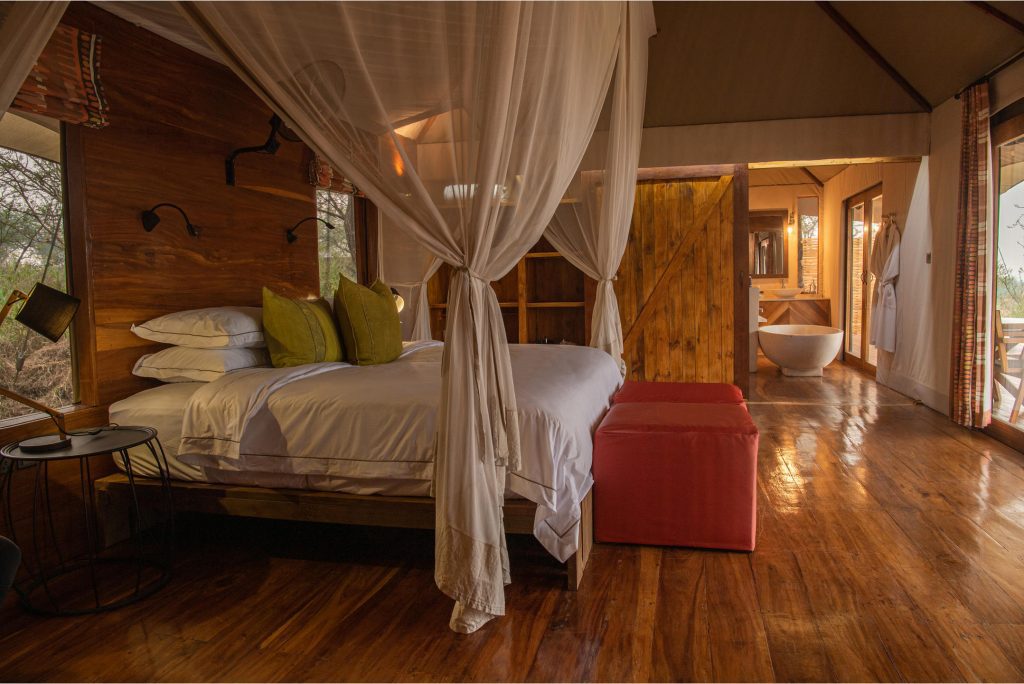 A view of the main bedroom of the family tent at the Asilia Sayari Camp
