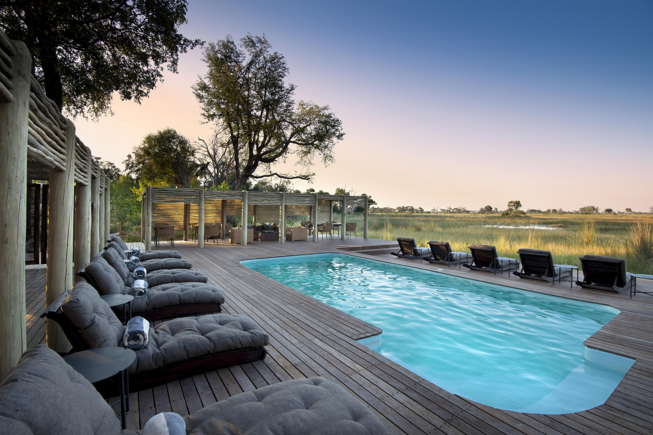 Public pool at andBeyond Nxabega Okavango Tented Camp, Botswana.