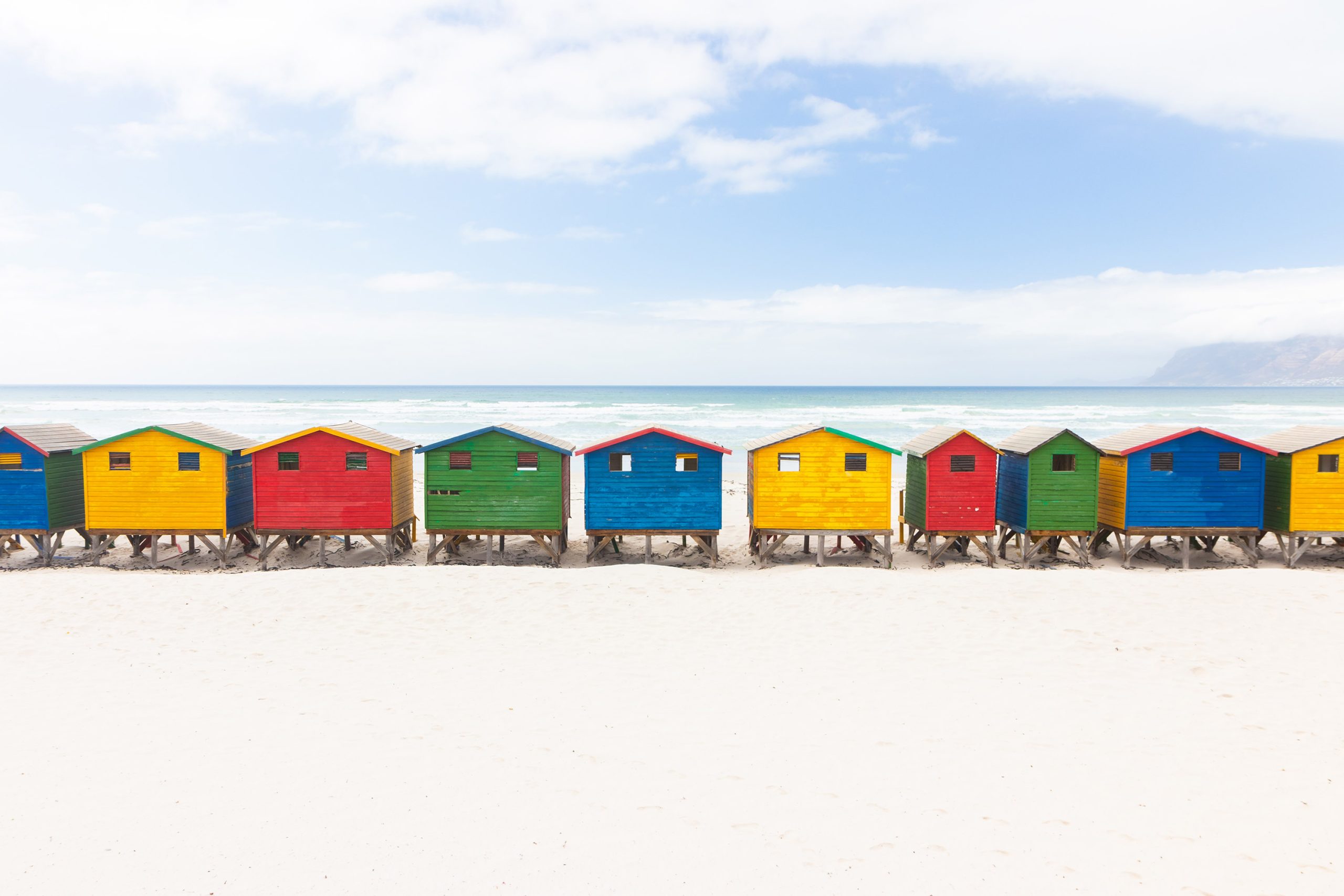 A row of colorful beach huts along one of the beaches in Cape Town