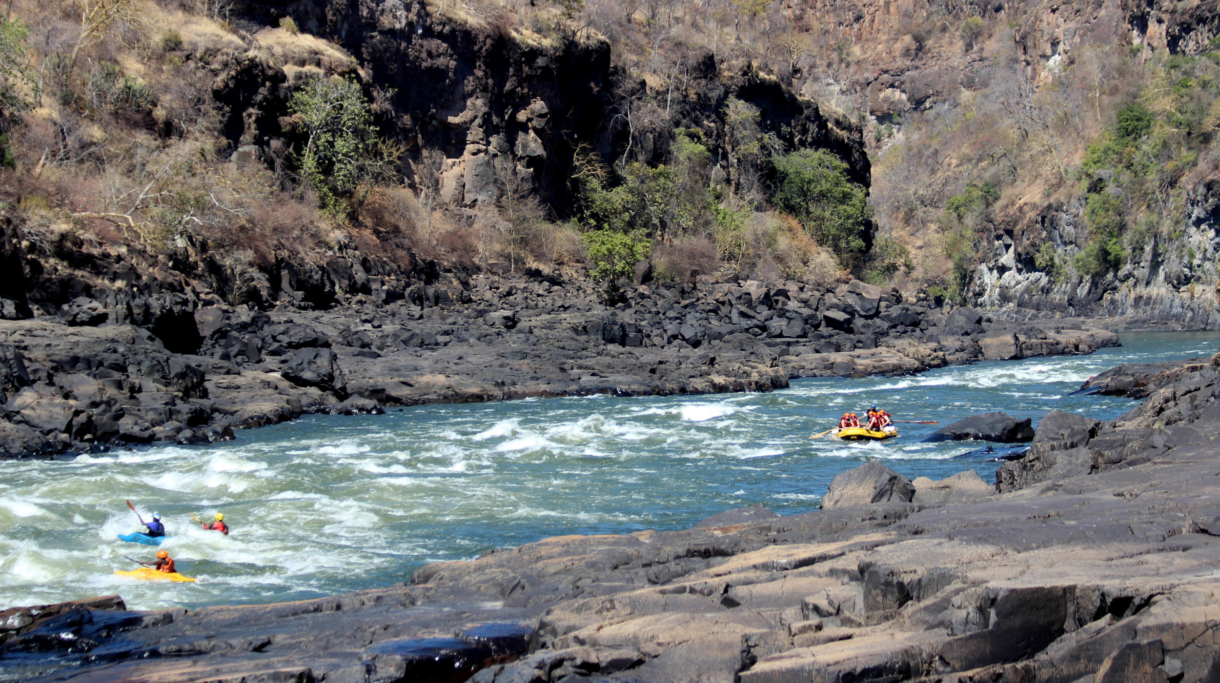 Visitors enjoying the white water rafting experience at Victoria Falls
