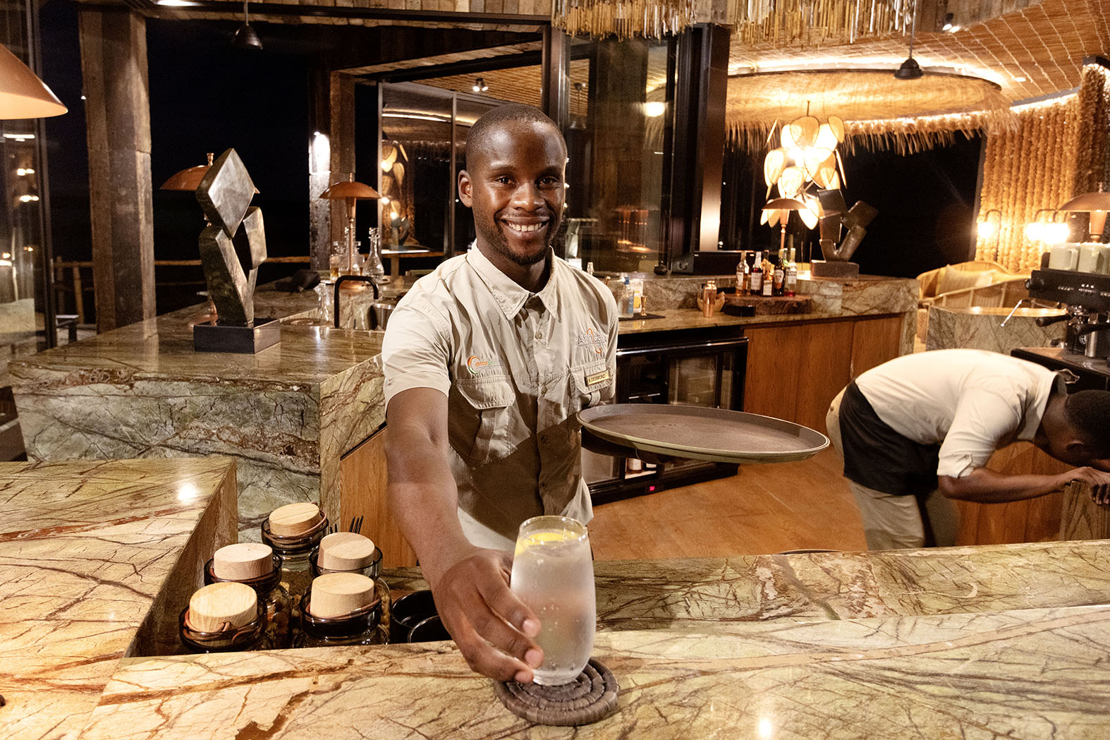 bartender at Lolebezi, serving the new Ubuntu Cocktail