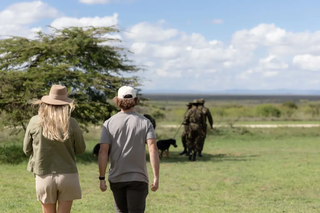 Co-founders, Kyle and Leah joining the K9 demonstration in Loisaba Conservancy, Kenya 