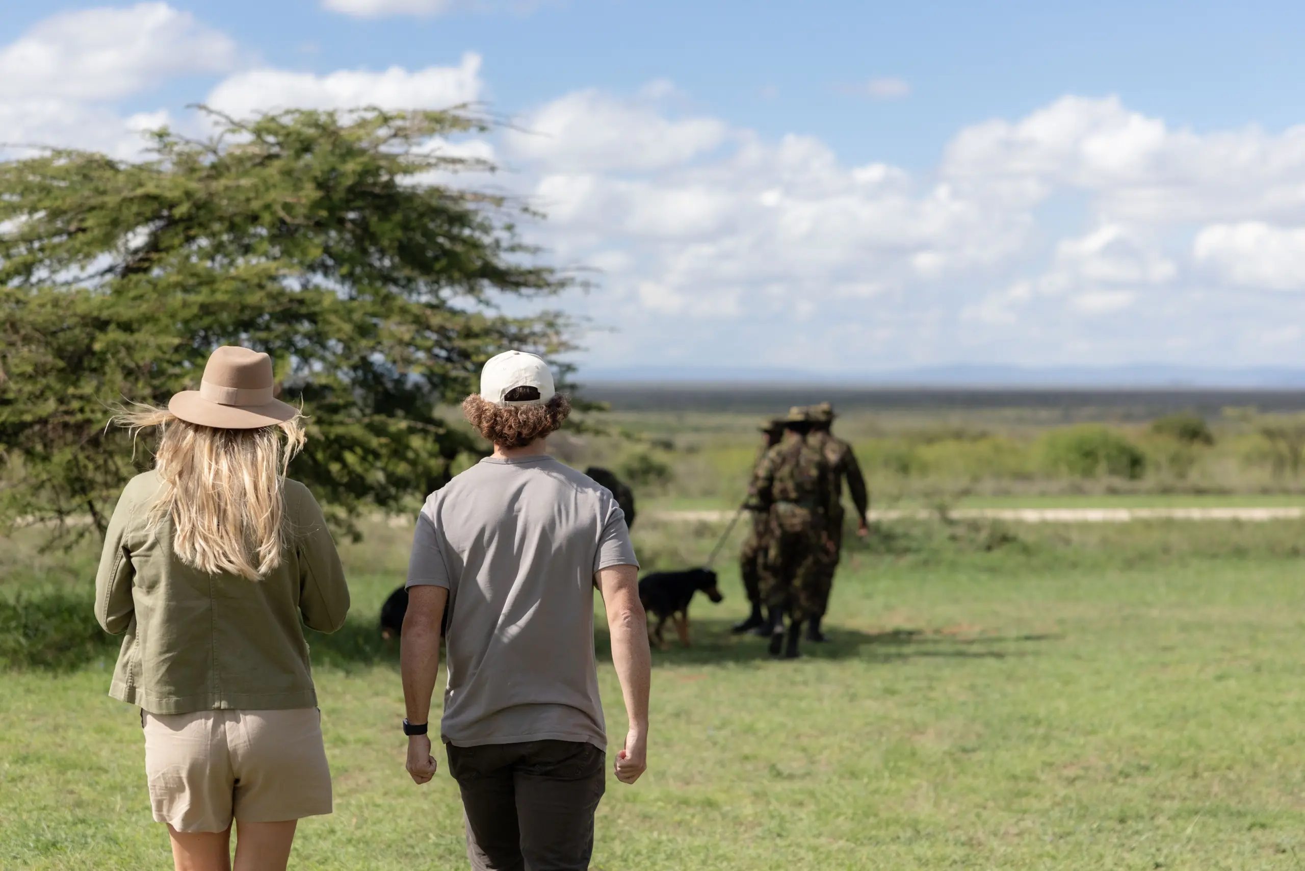 Co-founders, Kyle and Leah joining the K9 demonstration in Loisaba Conservancy, Kenya 