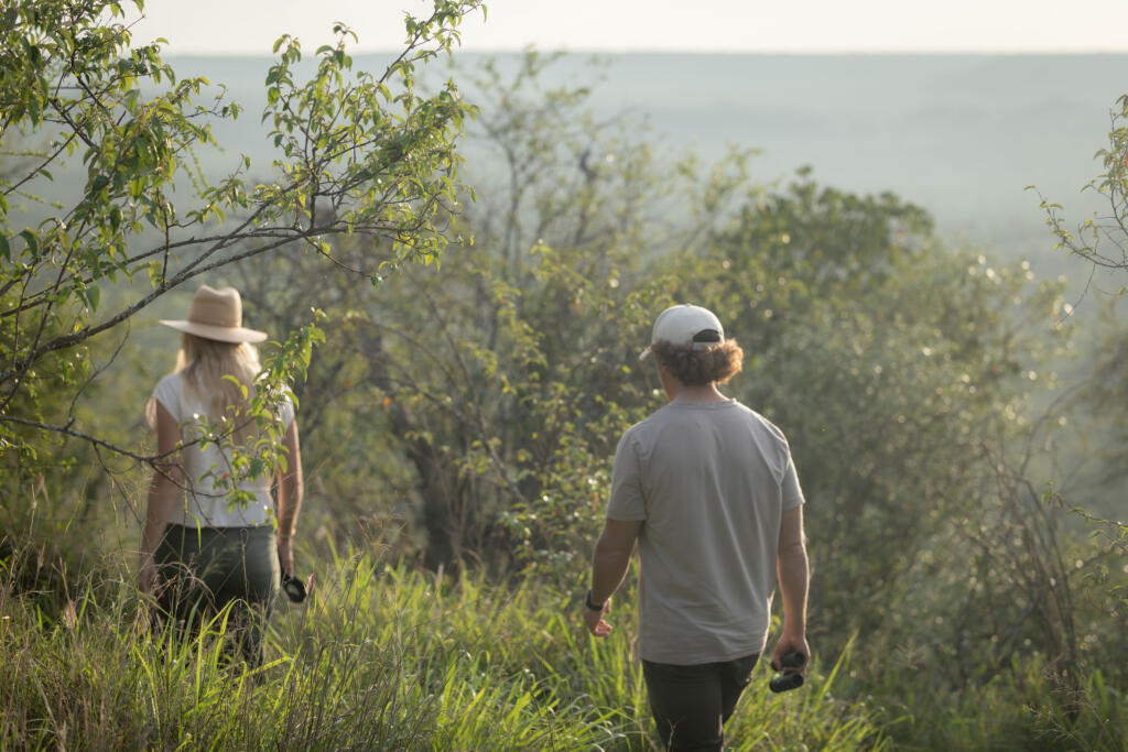 Co-founders, Kyle and Leah Green on a walking safari at andBeyond Suyian, Laikipia Plateau, Kenya 
