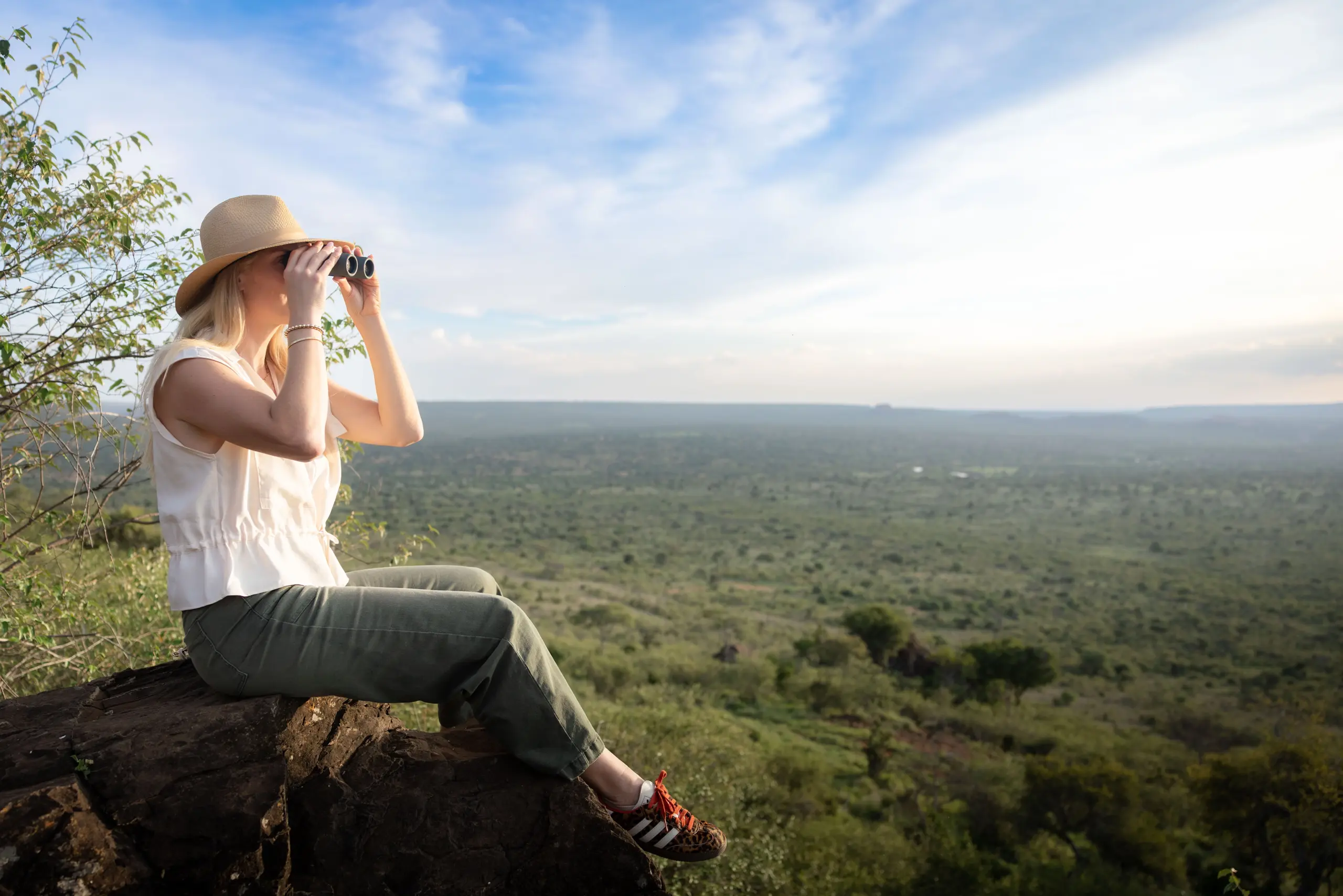 Ubuntu Travel Design Specialists, Leah Green, scanning the panoramic views of the Suyian Conservancy, Laikipia. Kenya. &Beyond Suyian, Suyian, Black leopard,